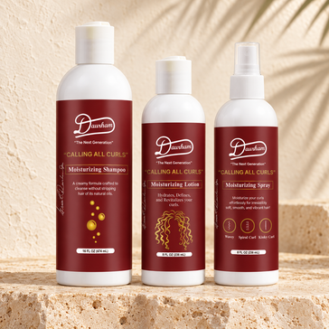 Daurham Calling All Curls Moisturizing Shampoo, Moisturizing Lotion and Moisturizing Spray in white bottles with deep red labels on a travertine stone ledge