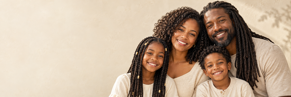 Smiling family with braids, curls and locs
